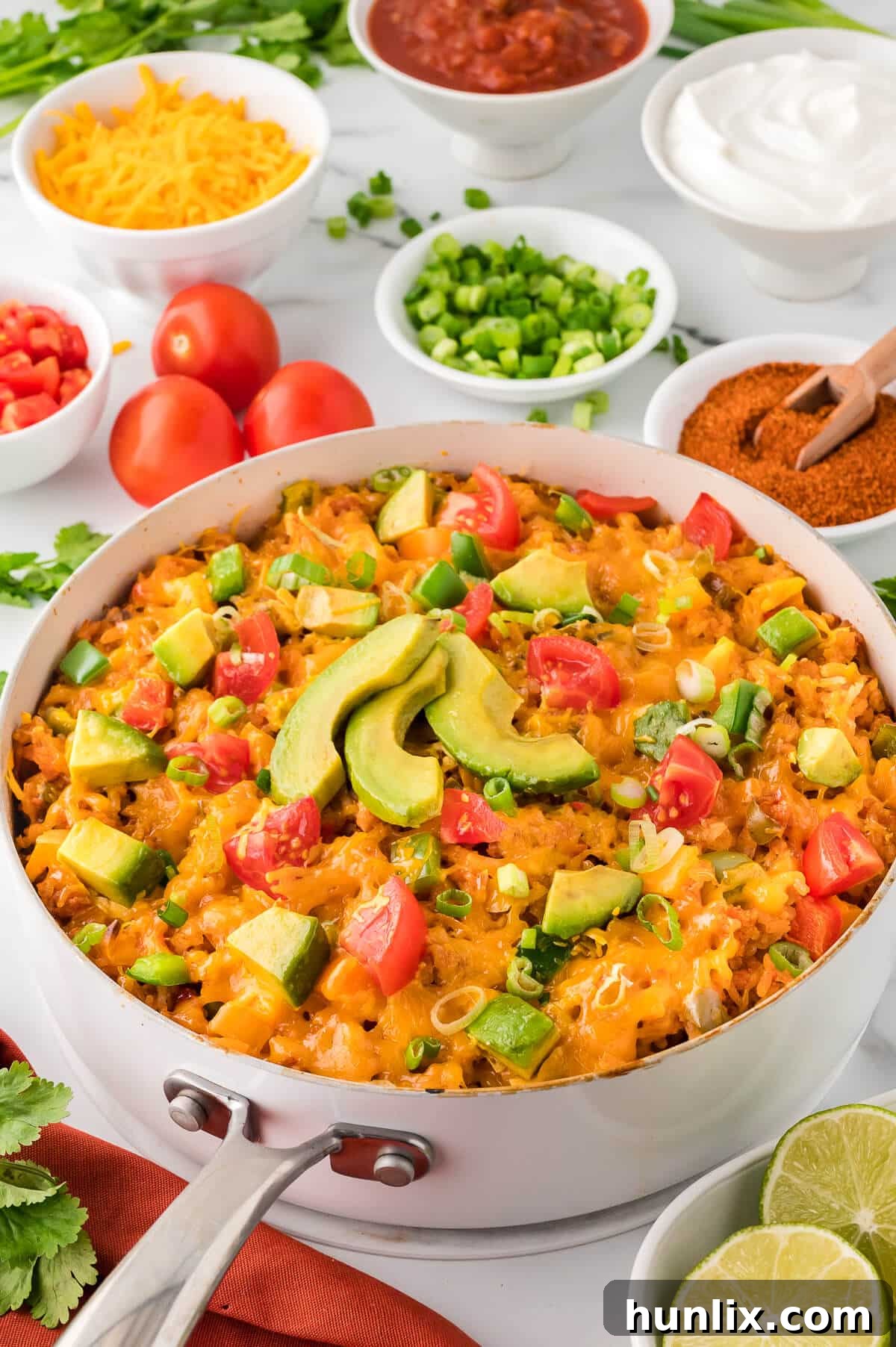 Close-up of chicken fajita rice in a pan, showcasing the melted cheese and colorful vegetables.