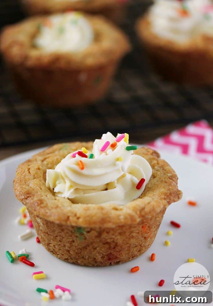 Birthday Cookie Cups - Your new birthday party staple! These bite-size cookie cups are filled with cream cheese frosting and bursting with sprinkles.