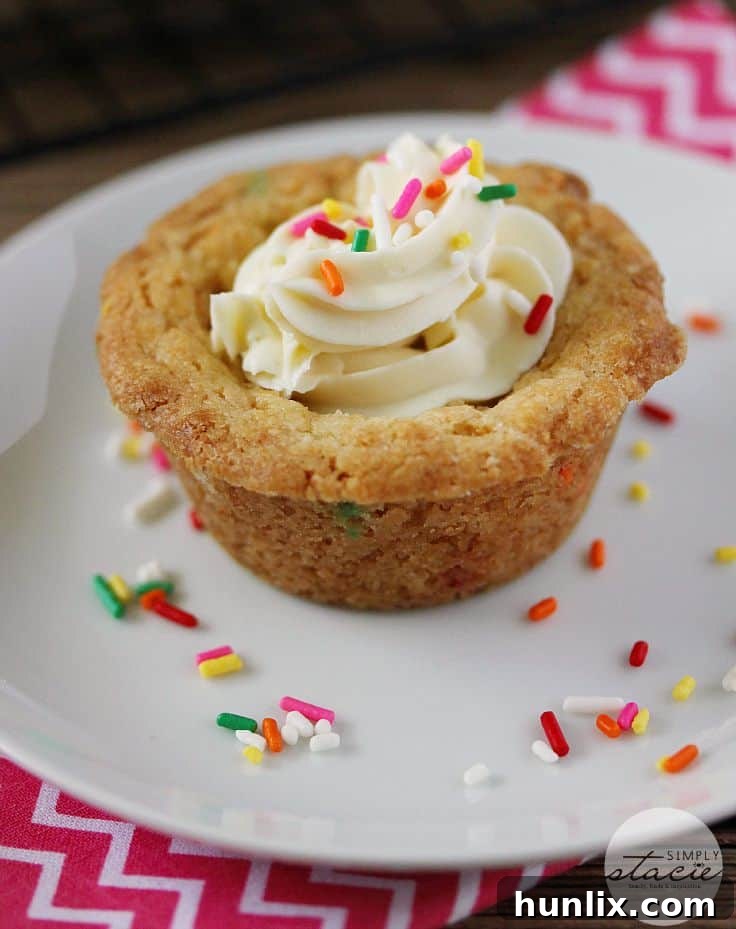 Birthday Cookie Cups - Your new birthday party staple! These bite-size cookie cups are filled with cream cheese frosting and bursting with sprinkles.
