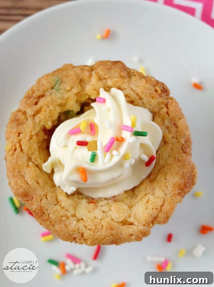 Birthday Cookie Cups - Your new birthday party staple! These bite-size cookie cups are filled with cream cheese frosting and bursting with sprinkles.