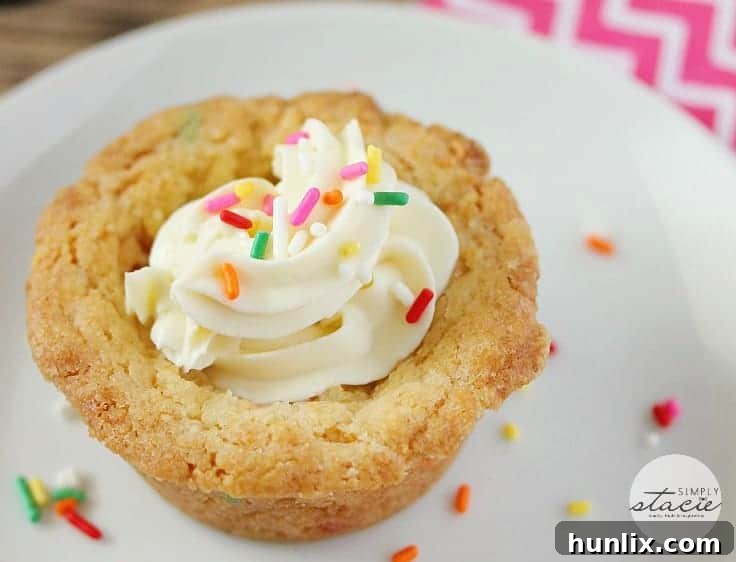 Birthday Cookie Cups - Your new birthday party staple! These bite-size cookie cups are filled with cream cheese frosting and bursting with sprinkles.