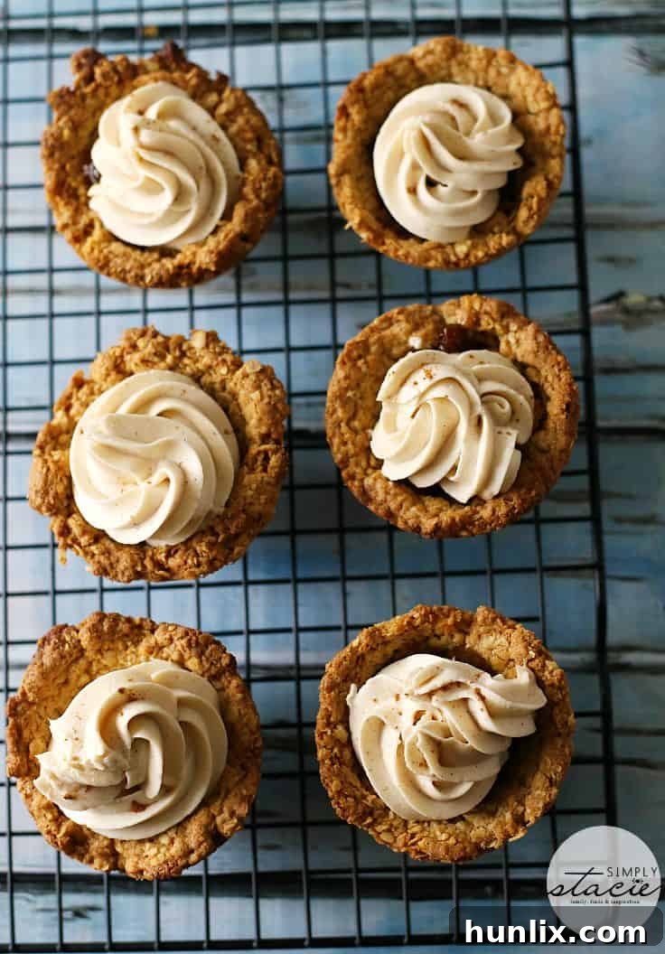 Close-up of a beautifully frosted Oatmeal Raisin Cookie Cup, showcasing its rich texture and appetizing layers.