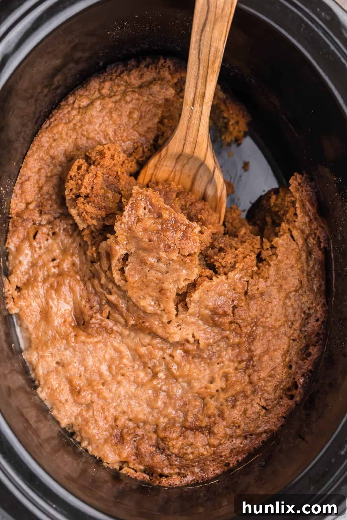 Slow Cooker Pumpkin Dump Cake - This is the easiest fall dessert! Your family will beg for this Crockpot dessert recipe made with boxed cake mix all year long.