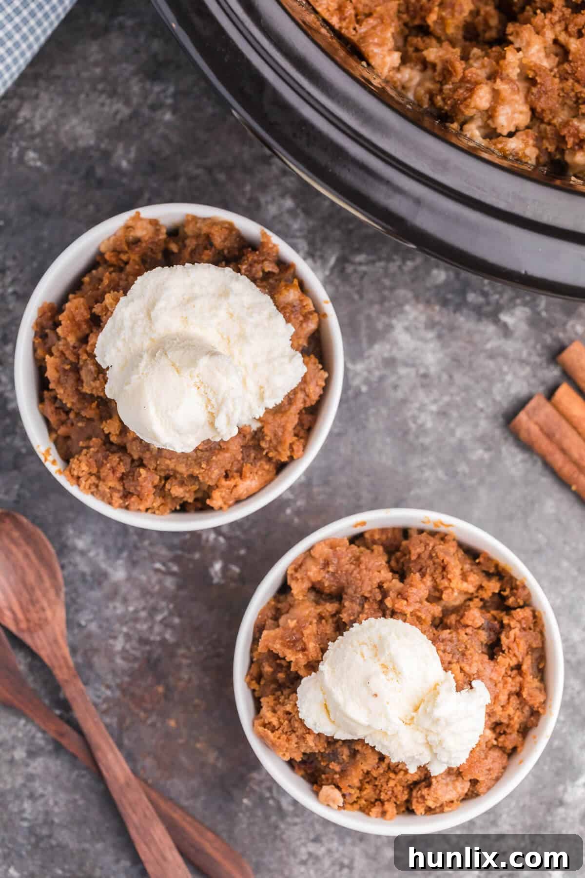 Slow Cooker Pumpkin Dump Cake - This is the easiest fall dessert! Your family will beg for this Crockpot dessert recipe made with boxed cake mix all year long.