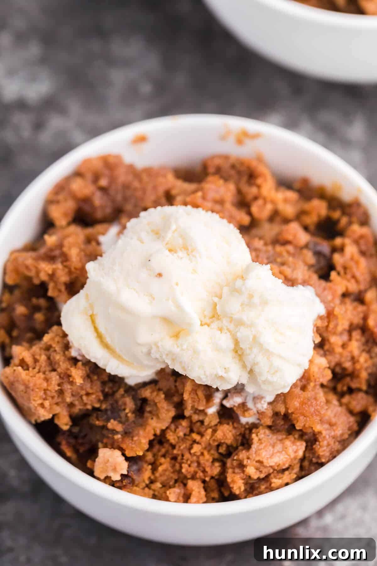 Slow Cooker Pumpkin Dump Cake - This is the easiest fall dessert! Your family will beg for this Crockpot dessert recipe made with boxed cake mix all year long.