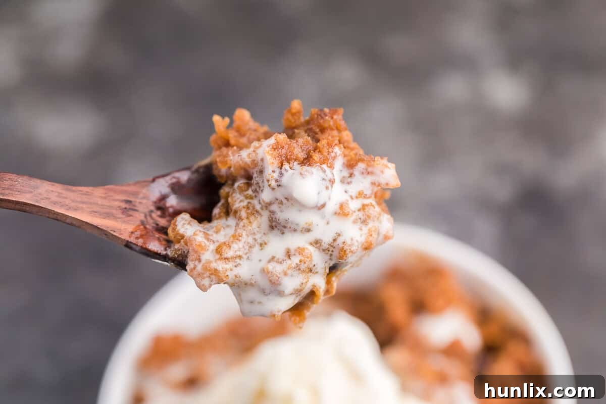 Slow Cooker Pumpkin Dump Cake - This is the easiest fall dessert! Your family will beg for this Crockpot dessert recipe made with boxed cake mix all year long.