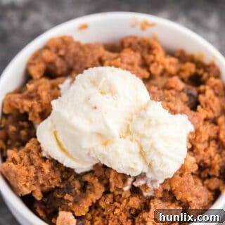Slow Cooker Pumpkin Dump Cake - This delicious fall dessert is quick and easy! The slow cooker can truly beat your oven for perfectly moist dump cakes.