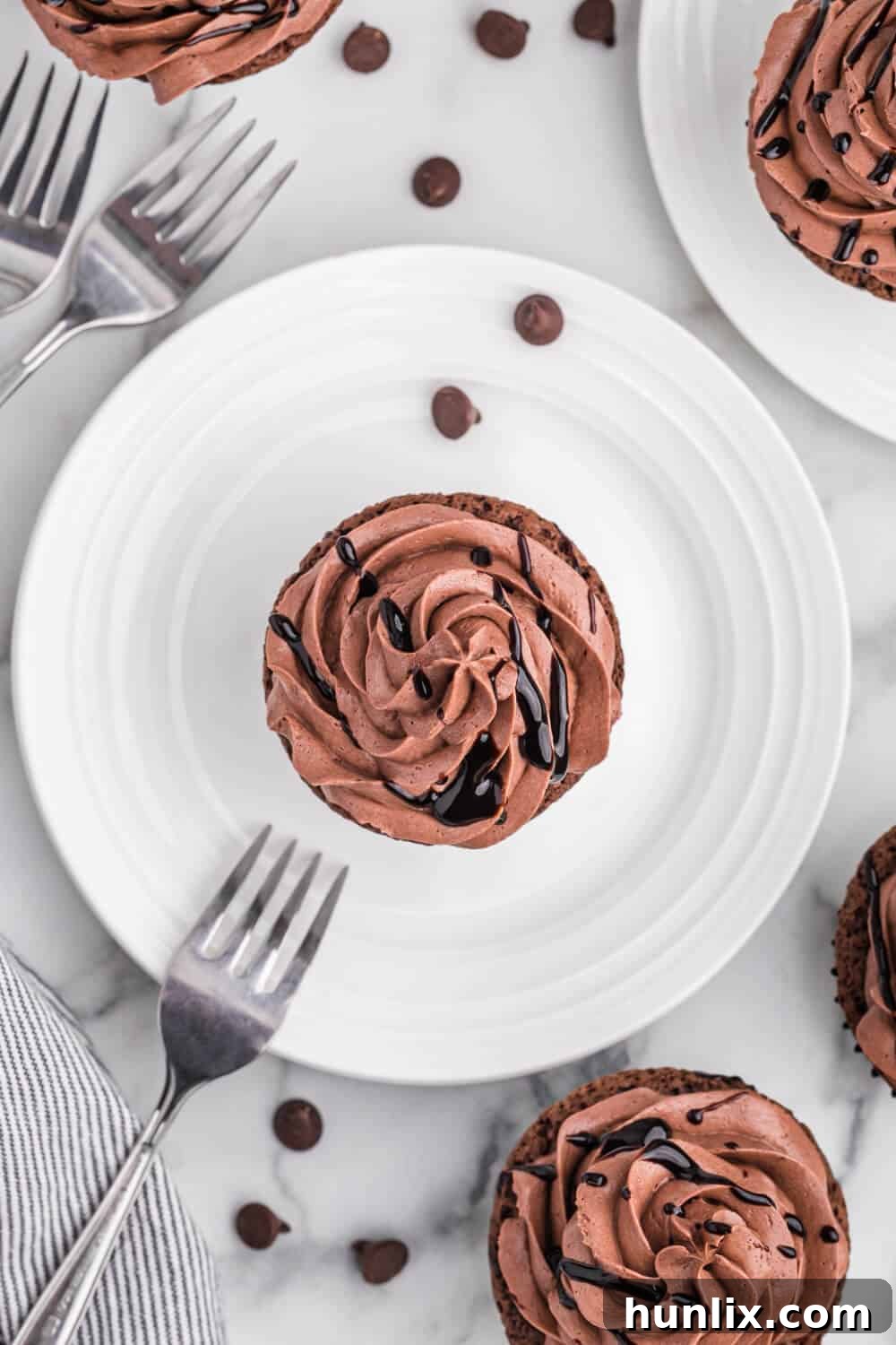 Death by Chocolate Cupcakes on a white plate with a fork