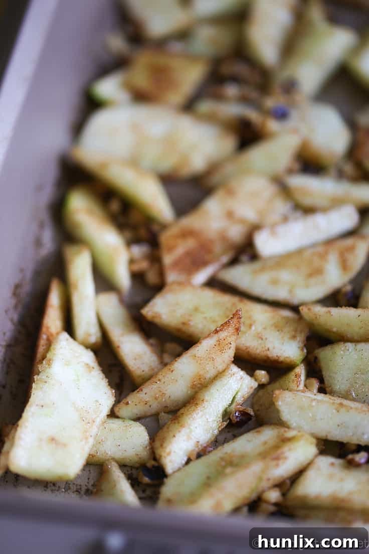 Caramelized Apple Inverted Delight 6 Greased baking pan with apple mixture – prepared Granny Smith apples, brown sugar, walnuts, and spices carefully arranged at the bottom of a greased baking dish.