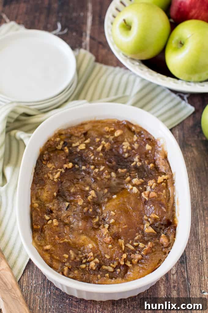 A delicious Apple Pie French Toast Casserole baked to golden perfection in a pan, ready to be served.