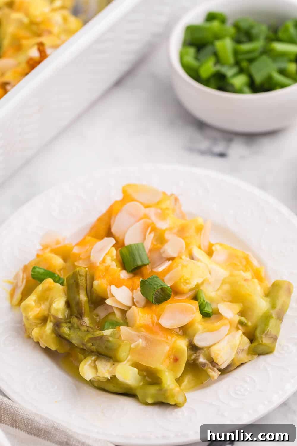 The finished Chicken Asparagus Bake, straight from the oven, bubbling with cheese and ready to be served.