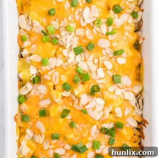 Chicken Asparagus Bake - Easily one of my favourite casserole dishes! It's loaded with asparagus, chicken, creamy curry sauce and smothered in cheese and sliced almonds.