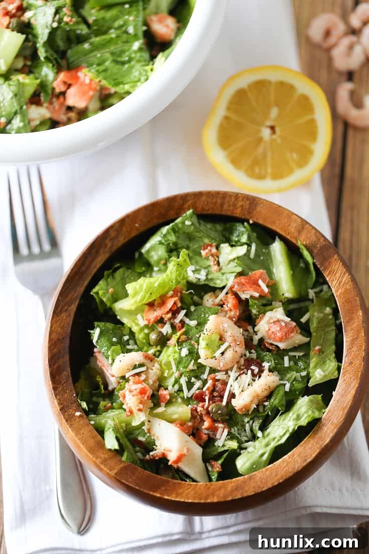 A vibrant and appetizing Seafood Caesar Salad, ready to be served.