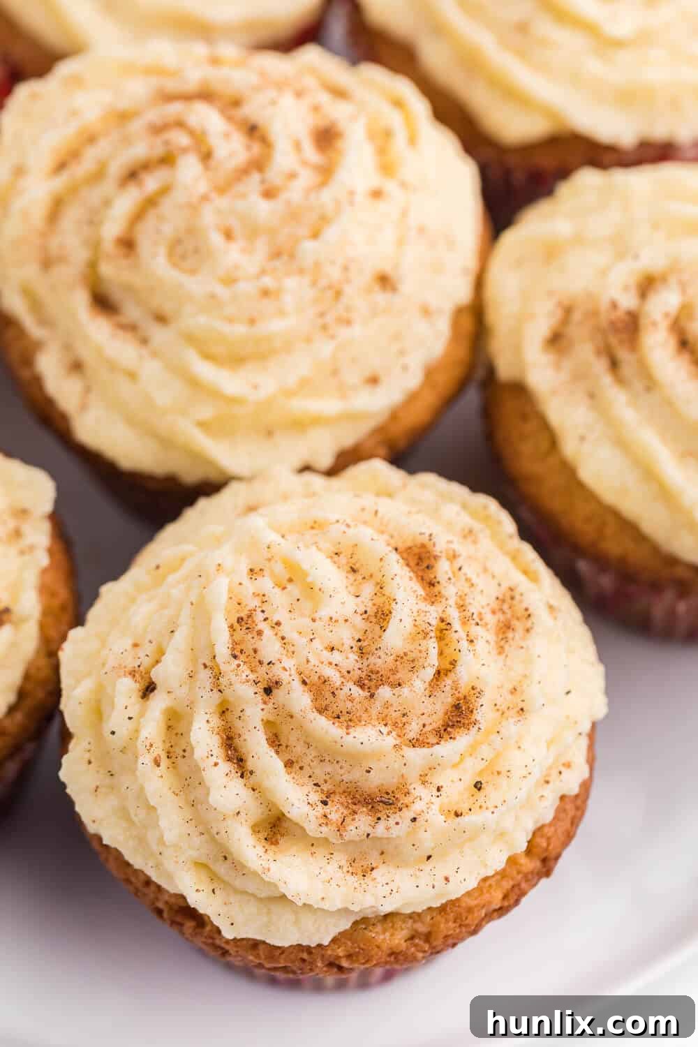 Close up of a beautifully frosted Eggnog Cupcake, ready for the holidays