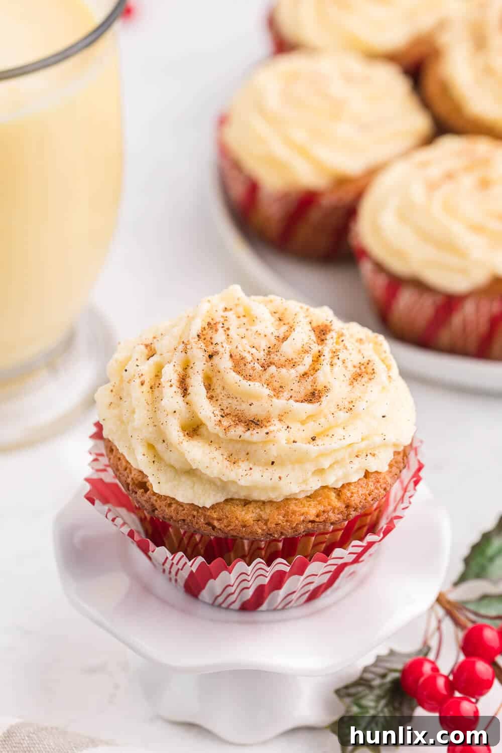 Elegant Eggnog Cupcake on a white stand, showcasing its holiday appeal