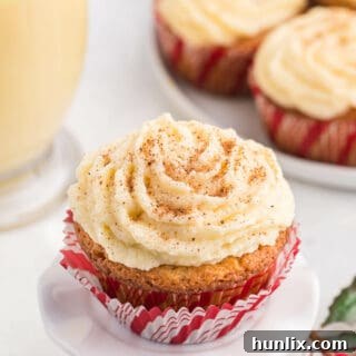 Eggnog cupcake on a white cupcake stand