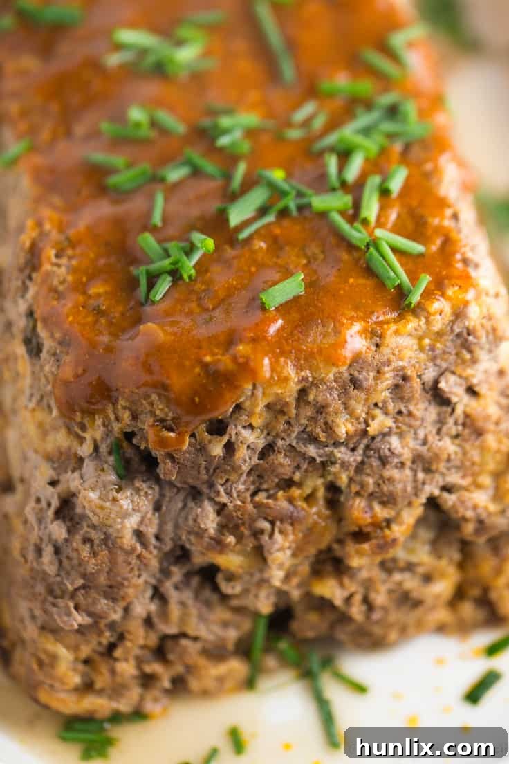 Masala Meatloaf 3 Close-up of a slice of Indian Meatloaf, showcasing its juicy texture and rich color.