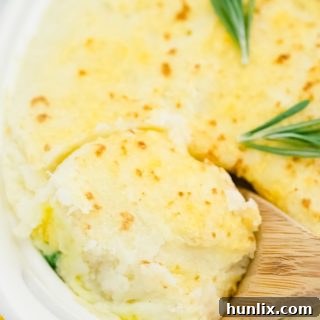 The recipe in a pan with a wooden spoon.