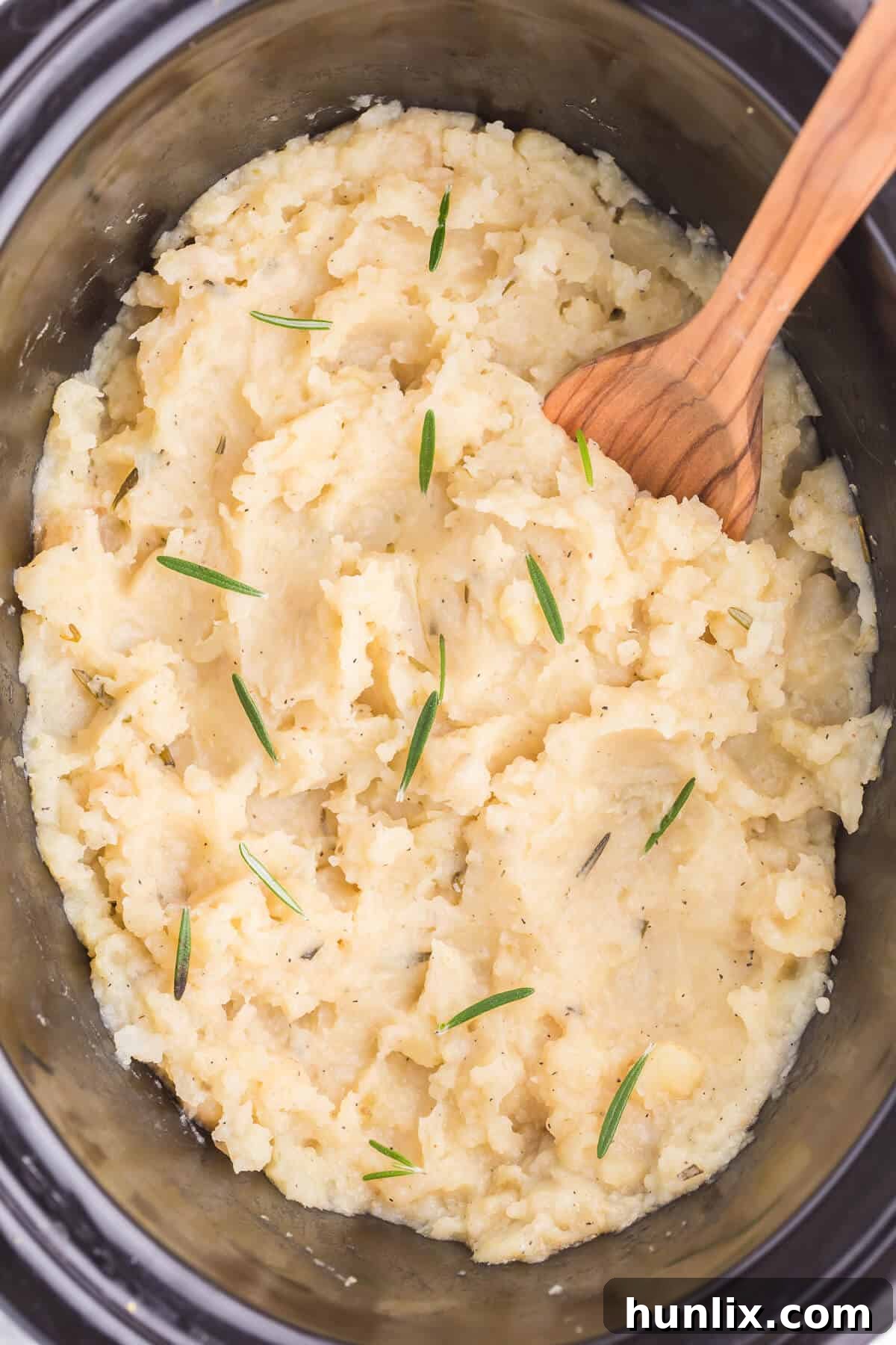 Infused Slow Cooker Rosemary Garlic Mash 2 Slow Cooker Rosemary Garlic Mashed Potatoes - Make the creamiest mashed potatoes in your Crockpot! You'll love the rich, garlicky flavor in every bite for a delicious fall side dish.