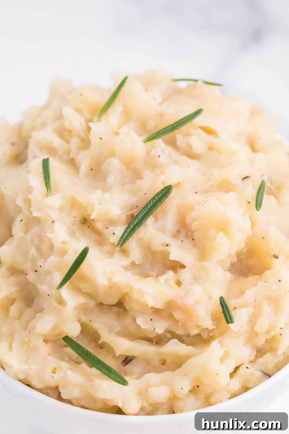 Infused Slow Cooker Rosemary Garlic Mash 5 Slow Cooker Rosemary Garlic Mashed Potatoes - Make the creamiest mashed potatoes in your Crockpot! You'll love the rich, garlicky flavor in every bite for a delicious fall side dish.