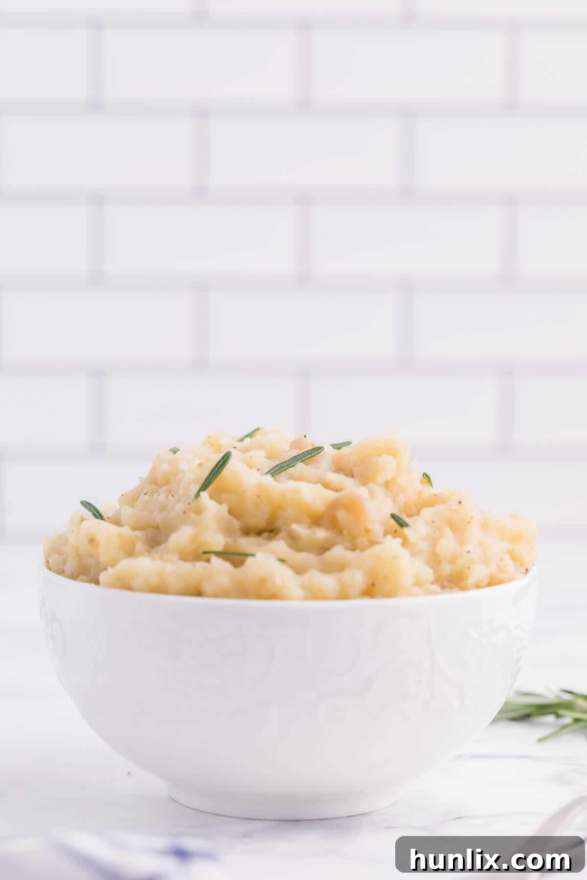 Infused Slow Cooker Rosemary Garlic Mash 6 Slow Cooker Rosemary Garlic Mashed Potatoes - Make the creamiest mashed potatoes in your Crockpot! You'll love the rich, garlicky flavor in every bite for a delicious fall side dish.
