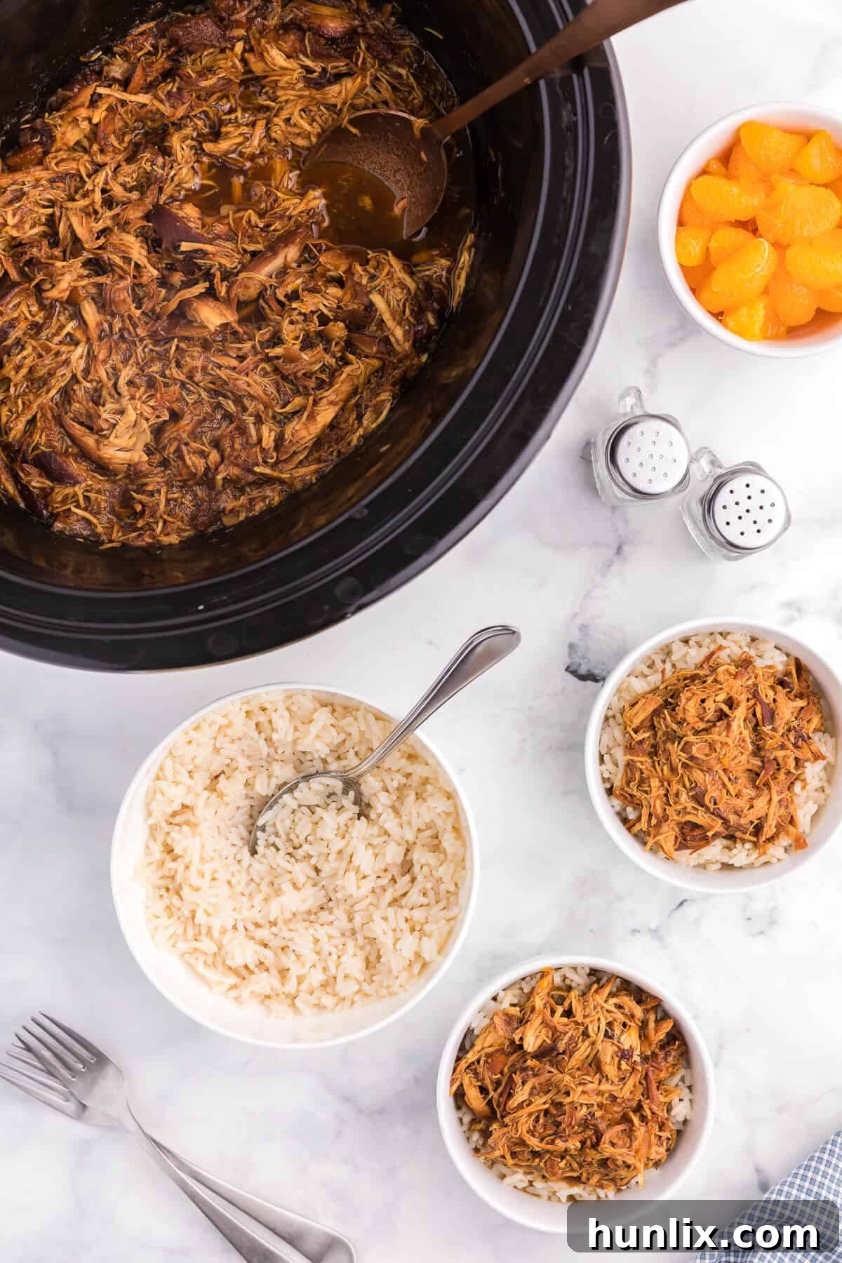 Tender shredded chicken infused with a sticky cranberry orange ginger sauce, a delicious and easy Crockpot recipe ideal for busy weeknights or holiday entertaining.