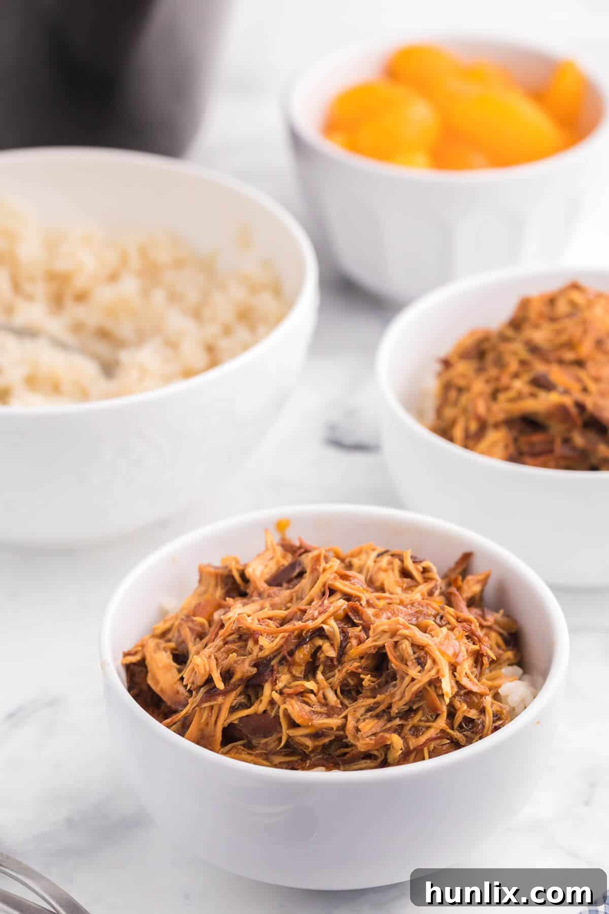 Easy Cranberry Orange Chicken recipe for Crockpot, featuring tender shredded chicken in a sticky, sweet, and tangy sauce, perfect for a family dinner.