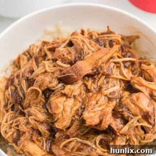 Cherry Coke Chicken - The easiest sweet and savory chicken recipe! Add some soda to your Crockpot for the most tender barbecue chicken breasts.