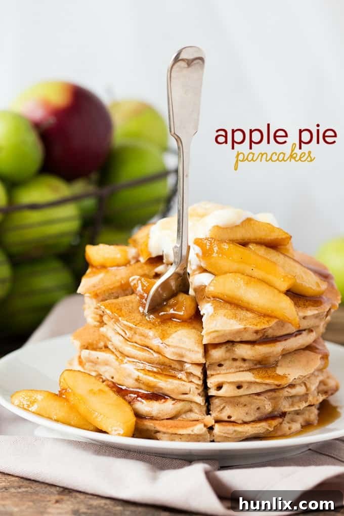 Apple Pie Pancakes with poached apples and crème fraîche, close up view.
