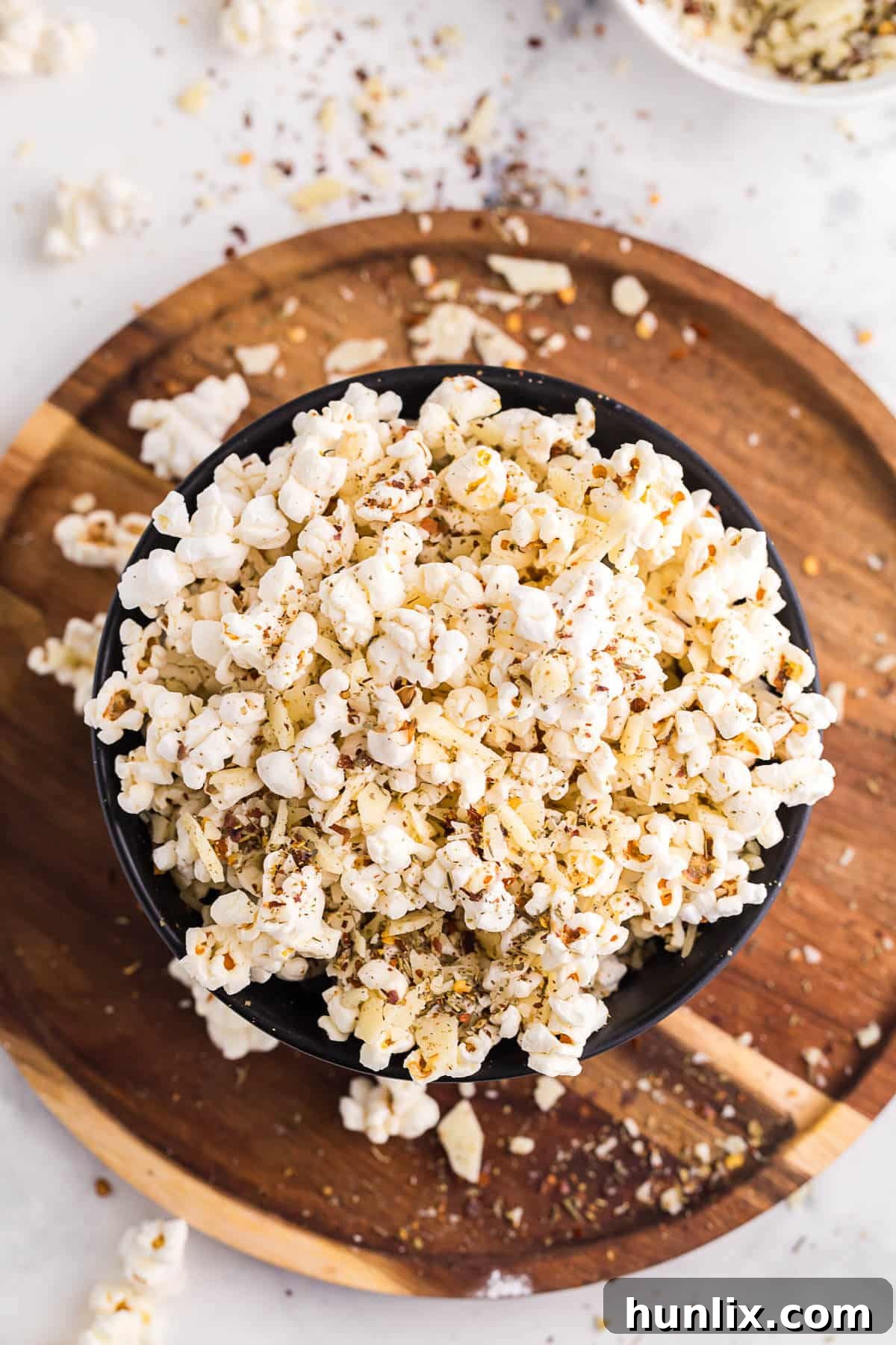 Another appealing shot of Pizza Popcorn nestled in a bowl, ready for enjoyment, emphasizing its delicious appeal as a savory snack.