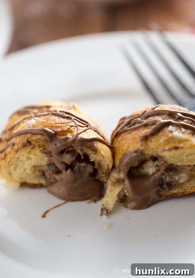 Sweet Hugs and Kisses Rolls 6 Hugs & Kisses Rolls - Imagine melted Hershey's Hugs and Hershey's Kisses tucked inside a warm crescent roll. Add a little powdered sugar and chocolate drizzle and you have yourself a heavenly treat! The perfect indulgence.