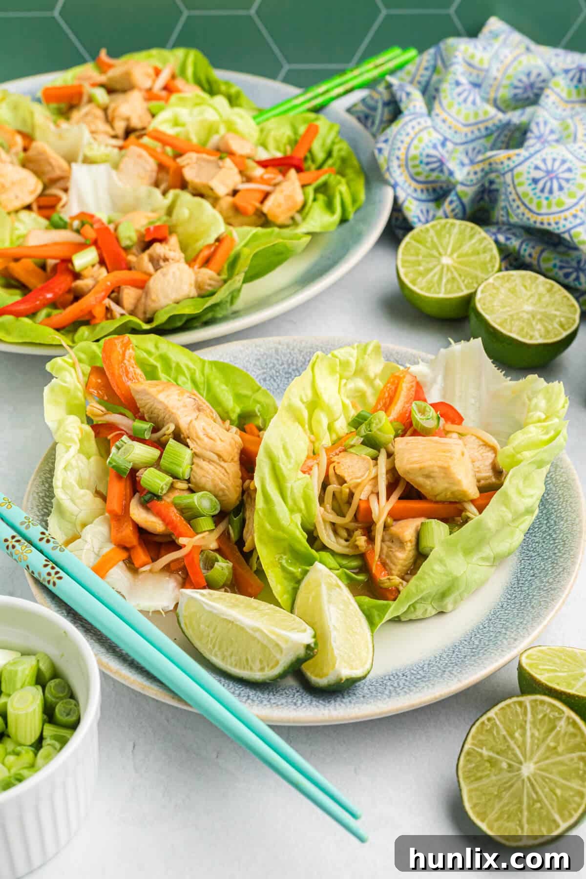 A close-up of Asian chicken lettuce wraps, showing the texture of the chicken and vegetables.