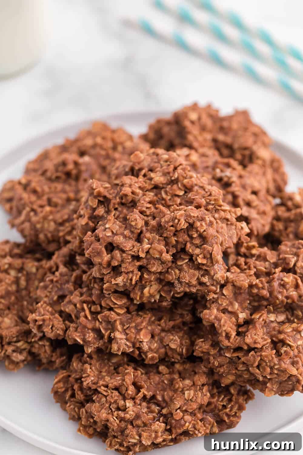 Close-up of no-bake chocolate peanut butter cookies arranged on a pristine white plate