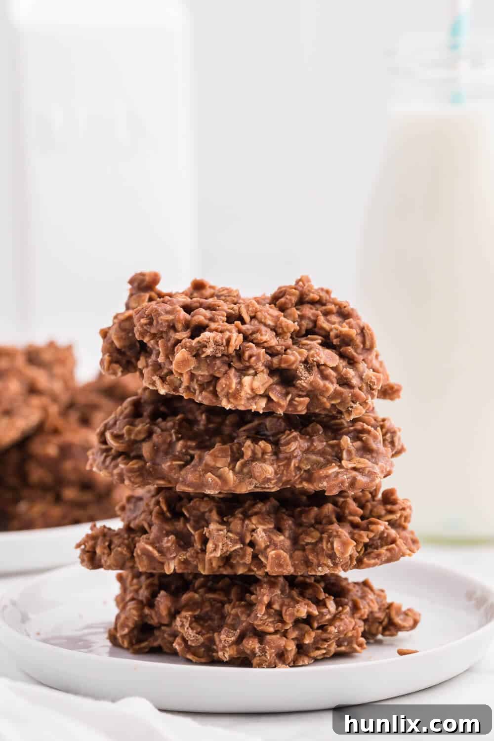 A stack of perfectly crafted no-bake chocolate peanut butter cookies, ready to be devoured