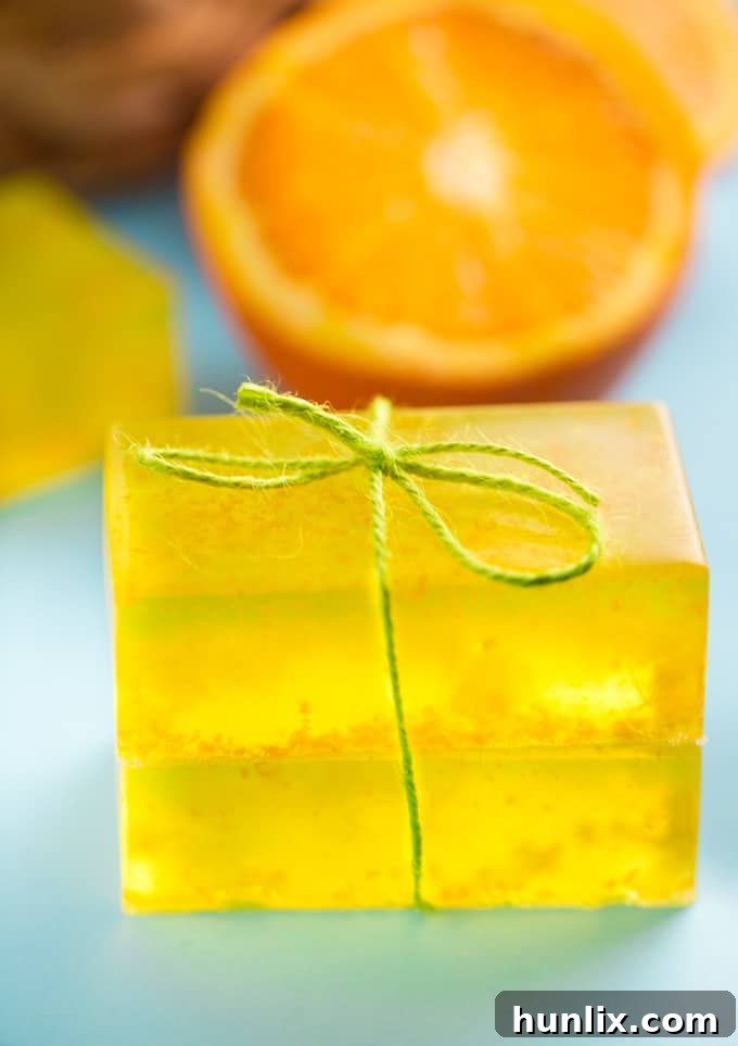 Zesty Sunshine Soap 2 Freshly made Orange Zest Soap bars with orange slices, showcasing a vibrant, invigorating aroma. Perfect for a morning energizer or a thoughtful gift.