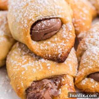 Easter egg stuffed crescent rolls on a white plate.