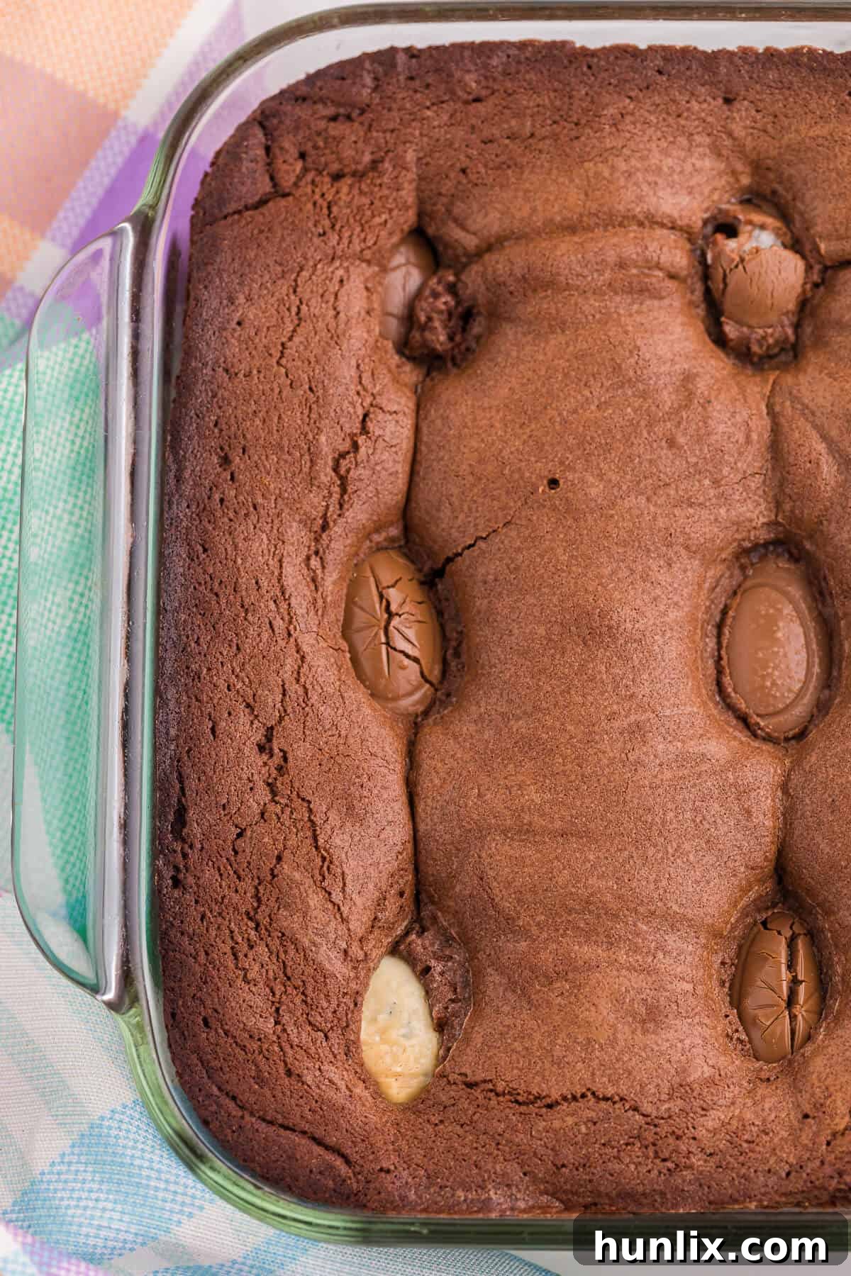 A fresh pan of Easter Egg Stuffed Brownies cooling on a wire rack.