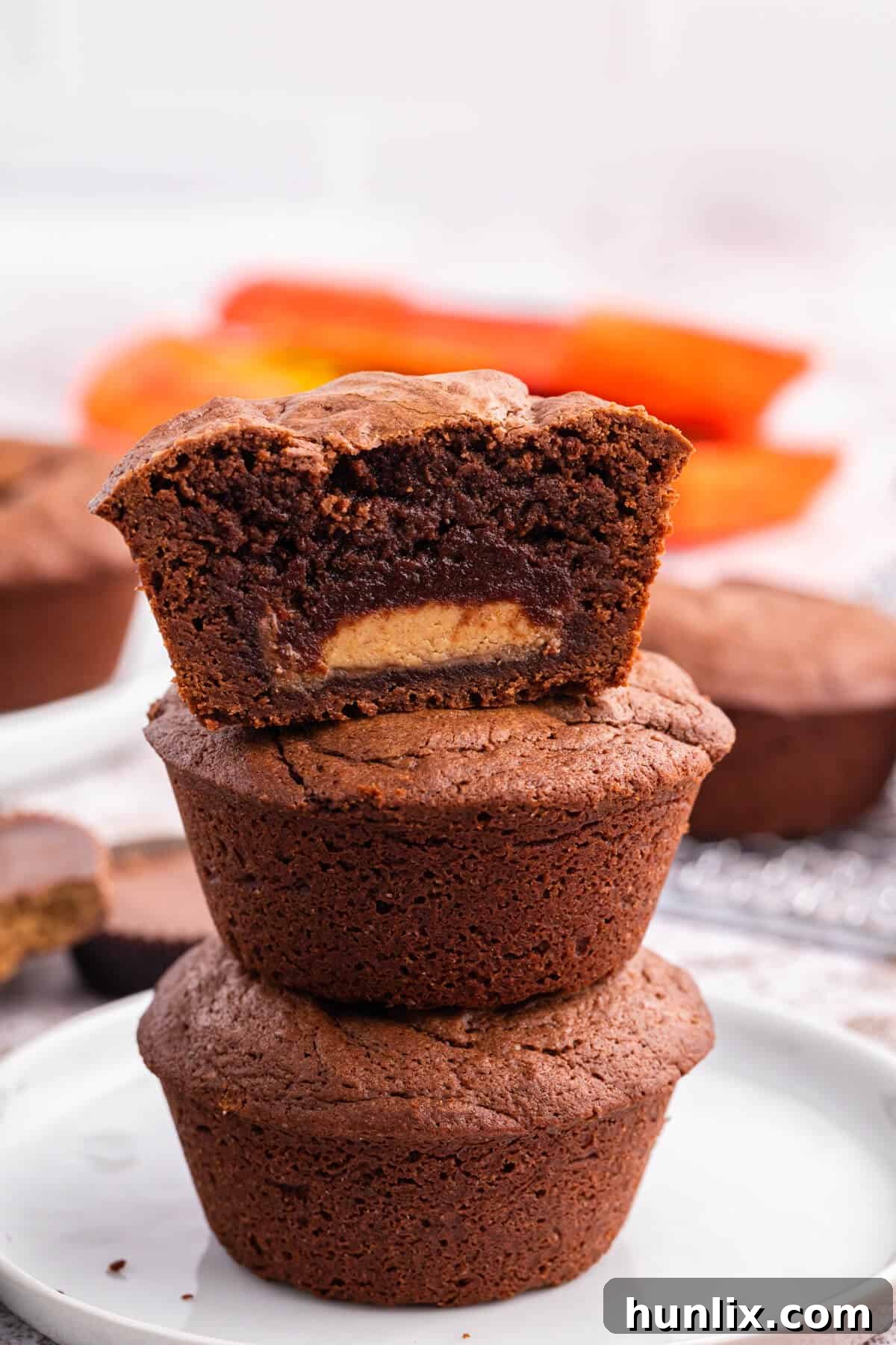 Reese's Peanut Butter Filled Brownies 4 A perfectly stacked pyramid of Reese's stuffed brownies, ready to be enjoyed as a delightful dessert.