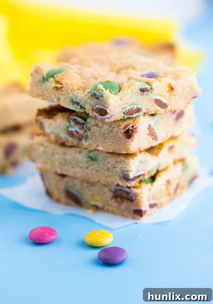 Irresistible Smarties Blondies - Chewy, sweet, and bursting with colorful Canadian Smarties. Perfect for a quick treat or to double for a crowd!