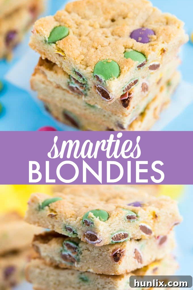 Close-up of freshly baked Smarties Blondies, showing their chewy texture and colorful candy pieces embedded throughout.
