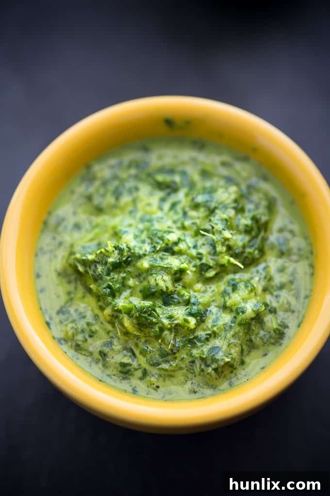 A serving of Tandoori Shrimp with Mint Chutney mixed in, ready to be enjoyed.