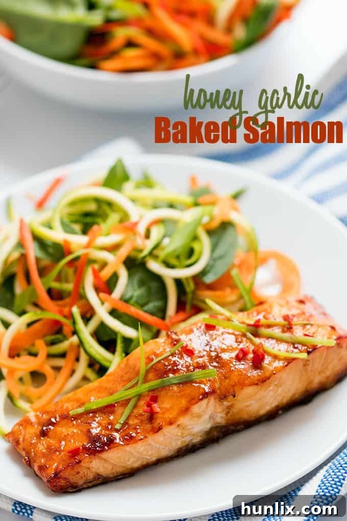 An appetizing image of honey garlic baked salmon with bold recipe title text overlay, inviting readers to try.