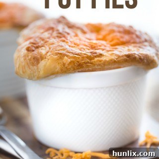 Comforting Chicken Broccoli and Cheddar Pot Pies 9 Chicken, Broccoli & Cheddar Pot Pies - Super cheesy and flavourful with a thick, creamy filling of savoury veggies, tender chicken and melted cheese baked in an ovenproof ramekin!