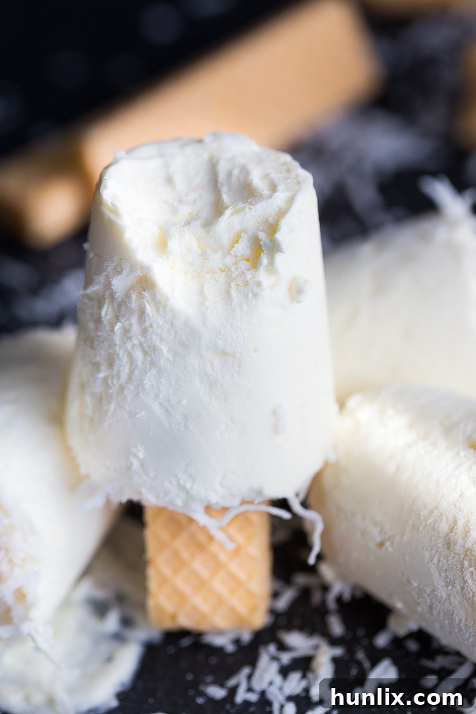 A perfectly peeled Coconut Creme Ice Pop