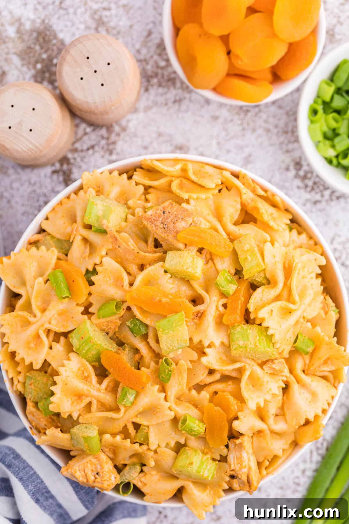 Golden Curry Chicken Pasta Salad 2 A bowl of creamy curried chicken pasta salad, perfect for summer gatherings.