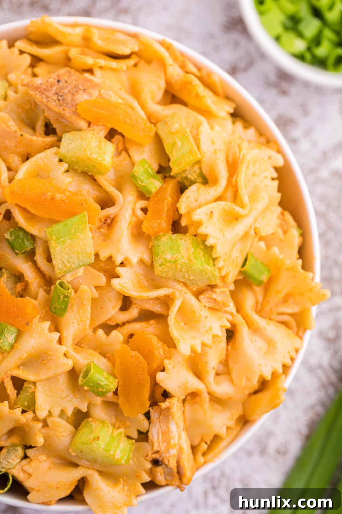 Golden Curry Chicken Pasta Salad 5 A generously filled bowl of creamy curried chicken pasta salad.