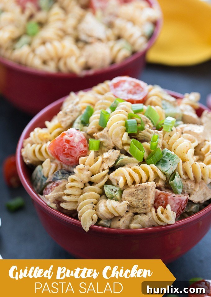 Close-up of the creamy dressing for Grilled Butter Chicken Pasta Salad, highlighting the mild, savory sauce that coats the chicken and pasta.