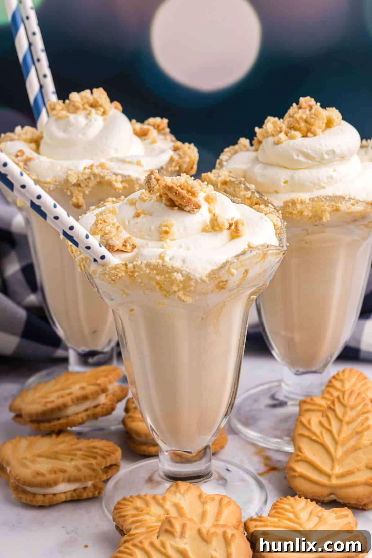 Velvet Maple Coffee Shake 7 Three glasses of maple coffee milkshakes surrounded by maple cream cookies.