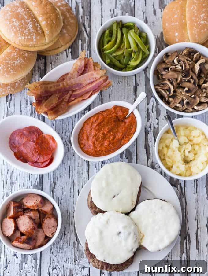 A vibrant spread of grilled toppings for a build-your-own Deluxe Pizza Burger bar, showcasing fresh ingredients.