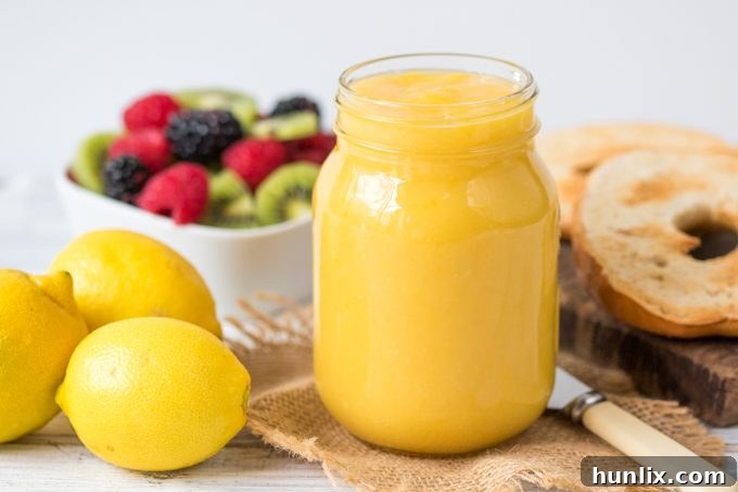 Homemade lemon curd in a glass jar.